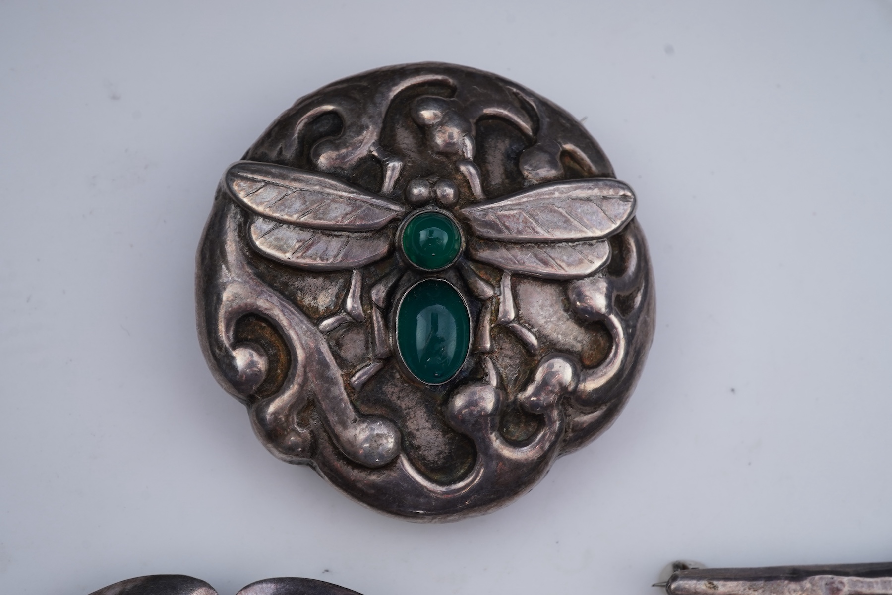 A collection of five Arts & Crafts silver brooches, Denmark, early-mid 20th century